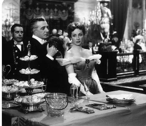 Woman and man sharing a quiet, emotional moment in a romantic office story